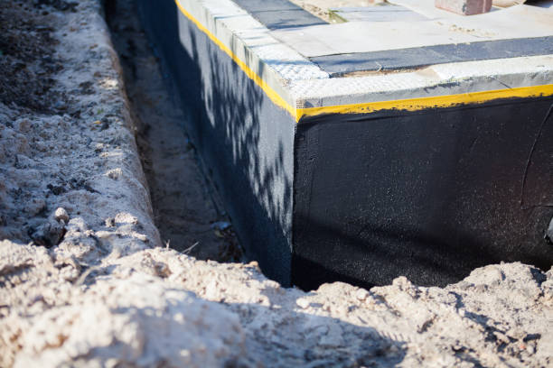 Professional Waterproofing technician working in Burton, MI
